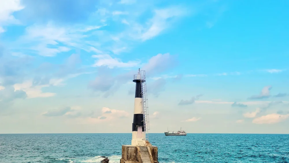 a lighthouse on a rocky shore in Andaman island